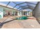 Inviting pool area with screened enclosure, ideal for relaxation and entertainment at 18138 Petoskey Cir, Port Charlotte, FL 33948