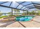 Relaxing pool and spa with screened enclosure and water views at 18138 Petoskey Cir, Port Charlotte, FL 33948