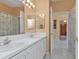 Bathroom with double sinks and shower/tub combo at 24088 Buckingham Way, Punta Gorda, FL 33980