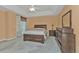Spacious bedroom with a double bed and dresser at 24088 Buckingham Way, Punta Gorda, FL 33980