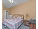 Bedroom with a king-size bed and nightstand at 24088 Buckingham Way, Punta Gorda, FL 33980