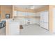 Clean and functional kitchen with white cabinetry and modern appliances at 24088 Buckingham Way, Punta Gorda, FL 33980