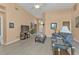 Open concept living room with ample natural light and neutral tones at 24088 Buckingham Way, Punta Gorda, FL 33980