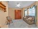 Cozy office space with a leather couch and wooden chair at 24088 Buckingham Way, Punta Gorda, FL 33980