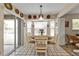 Bright dining area with a round table and chairs, view of pool at 2442 Cologne Ln, Punta Gorda, FL 33983