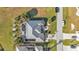 An aerial view of a house with a pool and lush landscaping at 26081 Templar Ln, Punta Gorda, FL 33983