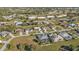 Aerial perspective of residential area, featuring homes and green areas at 26081 Templar Ln, Punta Gorda, FL 33983