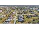 Aerial view of a single Gathering home and surrounding neighborhood at 26081 Templar Ln, Punta Gorda, FL 33983