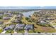 Aerial view of a house near a lake in a residential area at 26081 Templar Ln, Punta Gorda, FL 33983