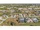Aerial view of a neighborhood with houses, roads, and landscaping at 26081 Templar Ln, Punta Gorda, FL 33983