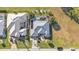 An aerial view of a home with a pool in a residential community at 26081 Templar Ln, Punta Gorda, FL 33983