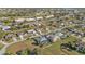 Aerial view of homes, roads, and lush landscaping in a community at 26081 Templar Ln, Punta Gorda, FL 33983