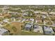 Aerial view showing neighborhood homes, roads, and green spaces at 26081 Templar Ln, Punta Gorda, FL 33983