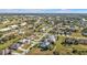Aerial view of a residential neighborhood with houses and landscaping at 26081 Templar Ln, Punta Gorda, FL 33983