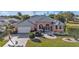 Attractive single-story home with a gray metal roof and a well-manicured lawn at 26081 Templar Ln, Punta Gorda, FL 33983