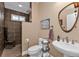Modern bathroom with walk-in shower and tiled floors at 26081 Templar Ln, Punta Gorda, FL 33983