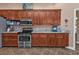 Well-equipped kitchen featuring stainless steel appliances and wood cabinets at 26081 Templar Ln, Punta Gorda, FL 33983