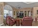 Relaxing living room with comfortable armchairs and a tiled floor at 26081 Templar Ln, Punta Gorda, FL 33983