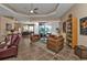Bright living room featuring comfortable seating and large windows at 26081 Templar Ln, Punta Gorda, FL 33983