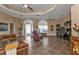 Open living area with high ceilings, tile flooring, and a ceiling fan at 26081 Templar Ln, Punta Gorda, FL 33983