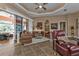 Open living space with modern furniture and access to a patio at 26081 Templar Ln, Punta Gorda, FL 33983