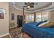Spacious main bedroom with a comfortable bed and window seat at 26081 Templar Ln, Punta Gorda, FL 33983