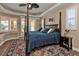 Main bedroom with a large four poster bed and sitting area at 26081 Templar Ln, Punta Gorda, FL 33983