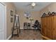 Home office with wooden wardrobe, shelving and comfortable armchair at 26081 Templar Ln, Punta Gorda, FL 33983