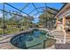 Inviting kidney-shaped pool with a screened enclosure at 26081 Templar Ln, Punta Gorda, FL 33983