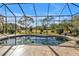 Inviting kidney-shaped pool with screened enclosure at 26081 Templar Ln, Punta Gorda, FL 33983