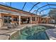 Relax by the pool and enjoy the view from the covered patio at 26081 Templar Ln, Punta Gorda, FL 33983