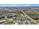 Aerial view of a residential community featuring villas and a central pool at 26155 Explorer Rd # 1C, Punta Gorda, FL 33983