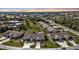 Aerial view showcasing community pool and surrounding villas at 26155 Explorer Rd # 1C, Punta Gorda, FL 33983