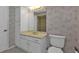 Bathroom with vanity, toilet and mirrored medicine cabinet at 26155 Explorer Rd # 1C, Punta Gorda, FL 33983