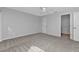 Bedroom with ceiling fan and access to bathroom at 26155 Explorer Rd # 1C, Punta Gorda, FL 33983