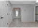 Bright entryway with tile flooring and access to other rooms at 26155 Explorer Rd # 1C, Punta Gorda, FL 33983