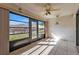 Florida room with tiled floor, ceiling fan and view at 26155 Explorer Rd # 1C, Punta Gorda, FL 33983