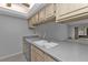 Kitchen sink and countertop with view into living area at 26155 Explorer Rd # 1C, Punta Gorda, FL 33983