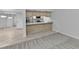 Open kitchen with breakfast bar and tile flooring at 26155 Explorer Rd # 1C, Punta Gorda, FL 33983