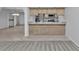 Open kitchen with breakfast bar and tile flooring at 26155 Explorer Rd # 1C, Punta Gorda, FL 33983