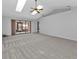 Spacious living room with high ceilings, skylights and carpet at 26155 Explorer Rd # 1C, Punta Gorda, FL 33983