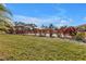 Community pool with fenced area and landscaping at 26155 Explorer Rd # 1C, Punta Gorda, FL 33983