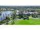 Golf course community overview with lake and houses at 3116 Silkwood Ln, Port Charlotte, FL 33953