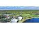 Community overview featuring houses, golf course, and a lake at 3116 Silkwood Ln, Port Charlotte, FL 33953