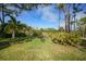 Landscaped backyard with lush greenery at 3116 Silkwood Ln, Port Charlotte, FL 33953