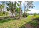 Backyard view with lush landscaping at 3116 Silkwood Ln, Port Charlotte, FL 33953