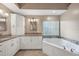Bathroom with a large corner soaking tub and double vanity at 3116 Silkwood Ln, Port Charlotte, FL 33953