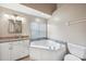 Bathroom with soaking tub, granite vanity, and separate shower at 3116 Silkwood Ln, Port Charlotte, FL 33953