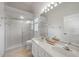 Double vanity bathroom with shower and mirror at 3116 Silkwood Ln, Port Charlotte, FL 33953