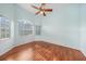 Bedroom with hardwood floors and ceiling fan at 3116 Silkwood Ln, Port Charlotte, FL 33953